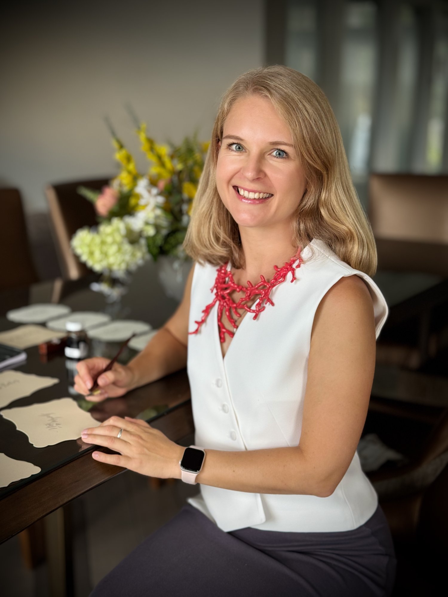 Dina at her calligraphy desk