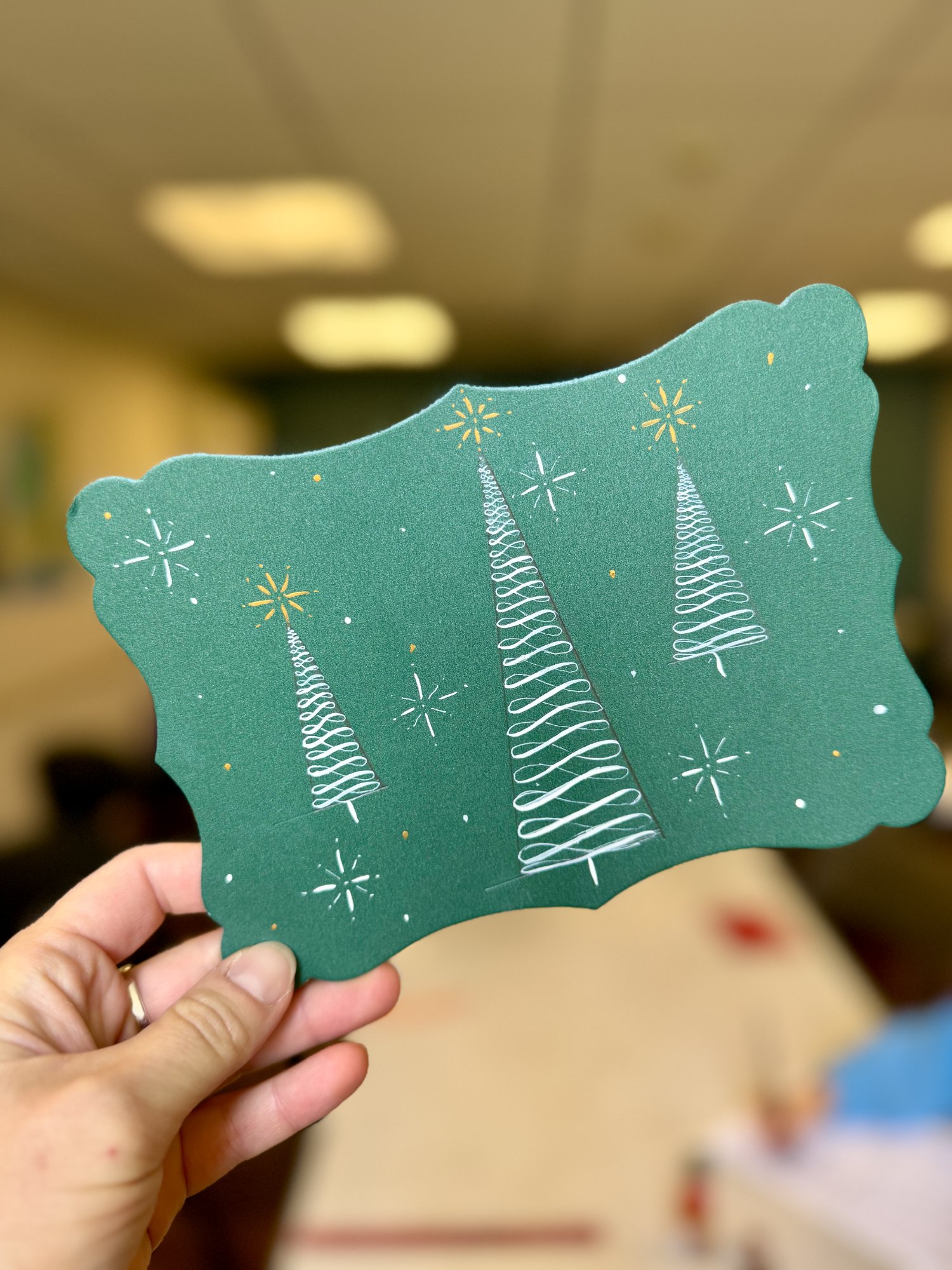 Green Christmas card with calligraphy trees